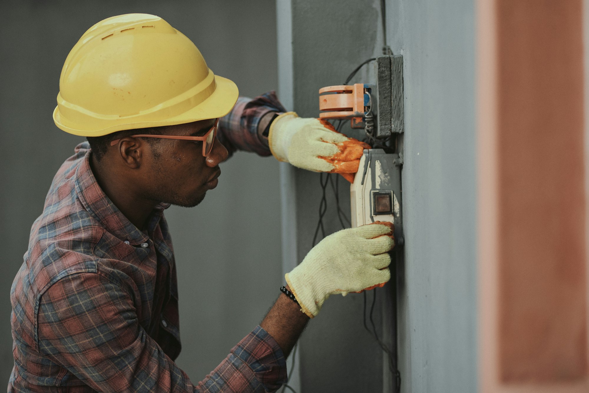 Kincaid Electric technician working inside an electrical panel
